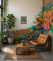 Modern living room with graffiti wall, plants, and a brown leather chair.